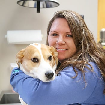 8D7A7837 Pet Grooming in White Bear Lake: Groomer Hugs Dog